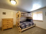 Lower level bedroom with twin over queen bunk bed